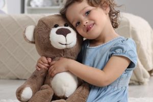Child-with-her-found-teddy-bear.jpg